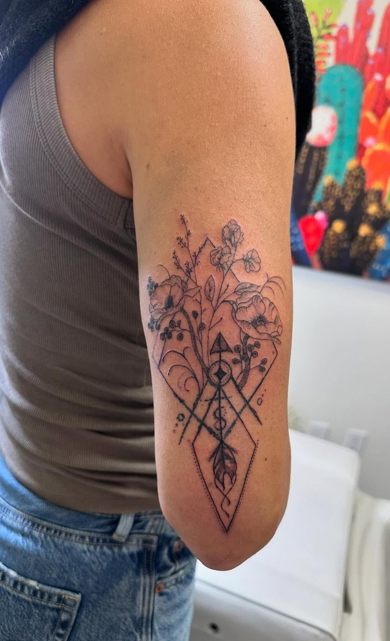 Artist preparing tools for a fine-line tattoo