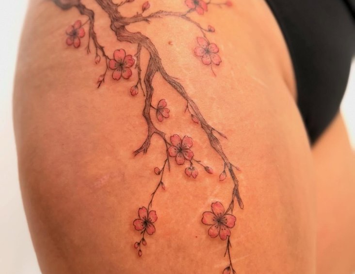 Shoulder tattoo being showcased outdoors