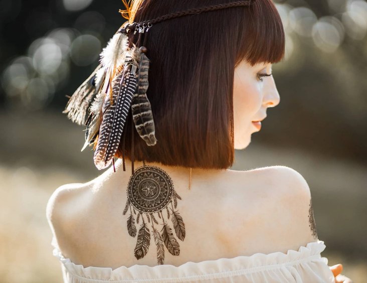 Shoulder tattoo being showcased outdoors