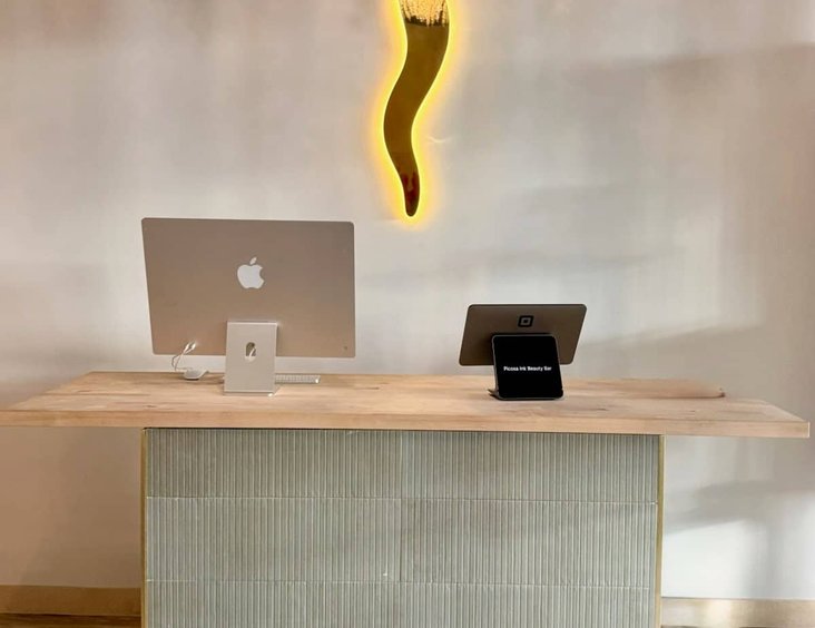 Picosa Ink branding display on studio shelf