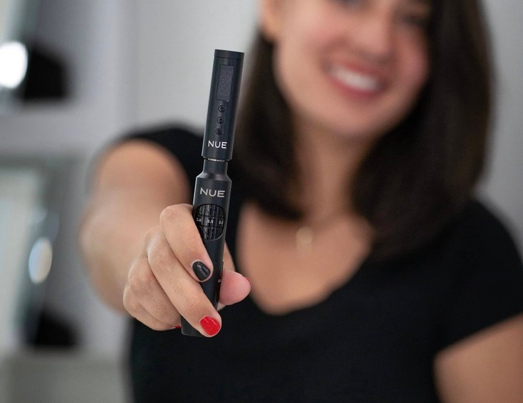Artist smiling and posing in the beauty studio