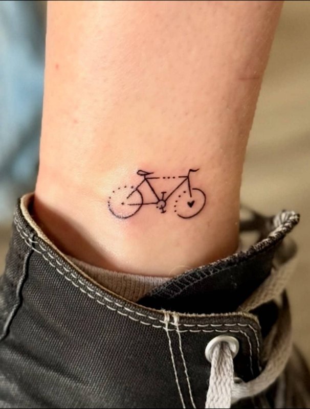 Fresh ankle tattoo with floral design